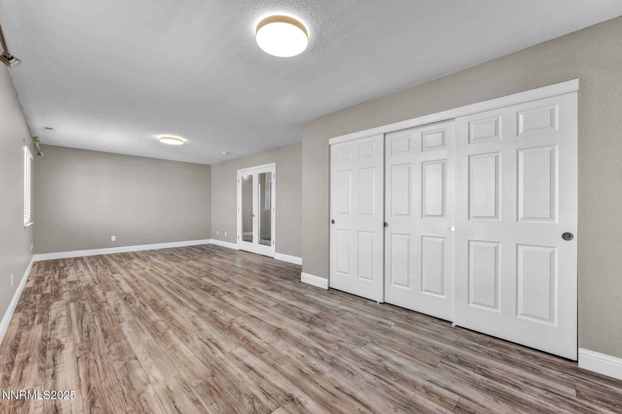 17391 Crystal Canyon Boulevard Reno, NV 89508 - Photo 39 of 63 a view of empty room with wooden floor