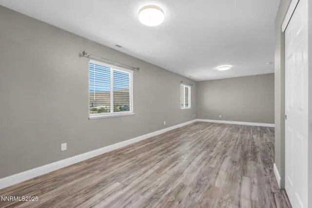 a view of entryway with wooden floor