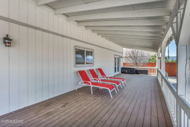 a backyard of a house with a yard and seating space