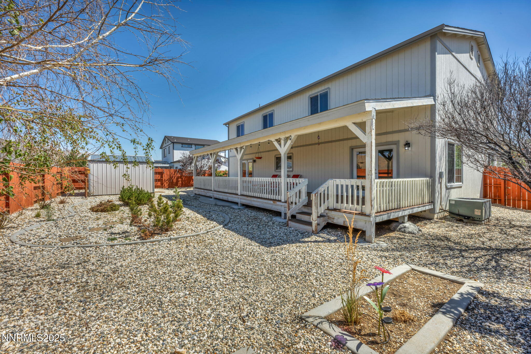 17391 Crystal Canyon Boulevard Reno, NV 89508 - Photo 56 of 63 a backyard of a house with a yard and seating space