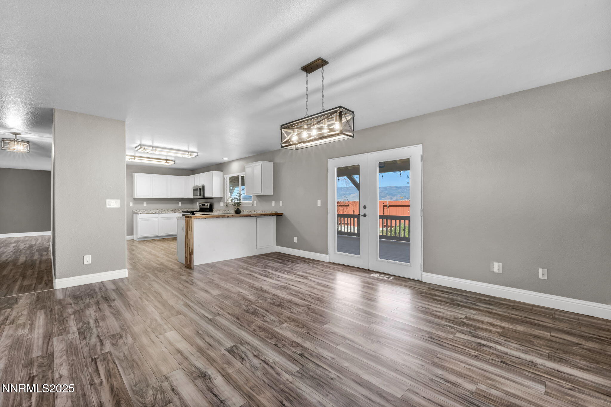 17391 Crystal Canyon Boulevard Reno, NV 89508 - Photo 10 of 63 a view of a kitchen with wooden floor and windows