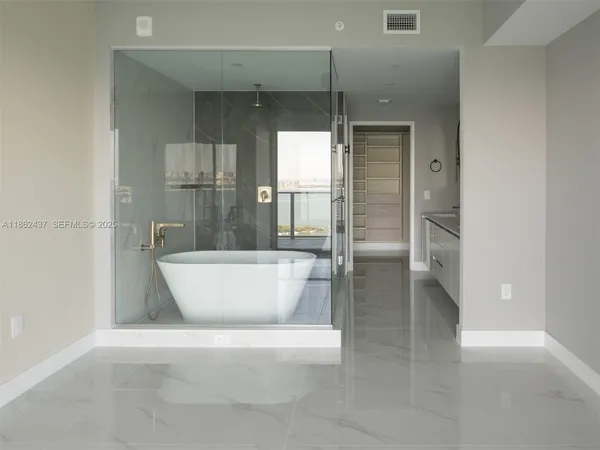 a view of an empty walk in closet