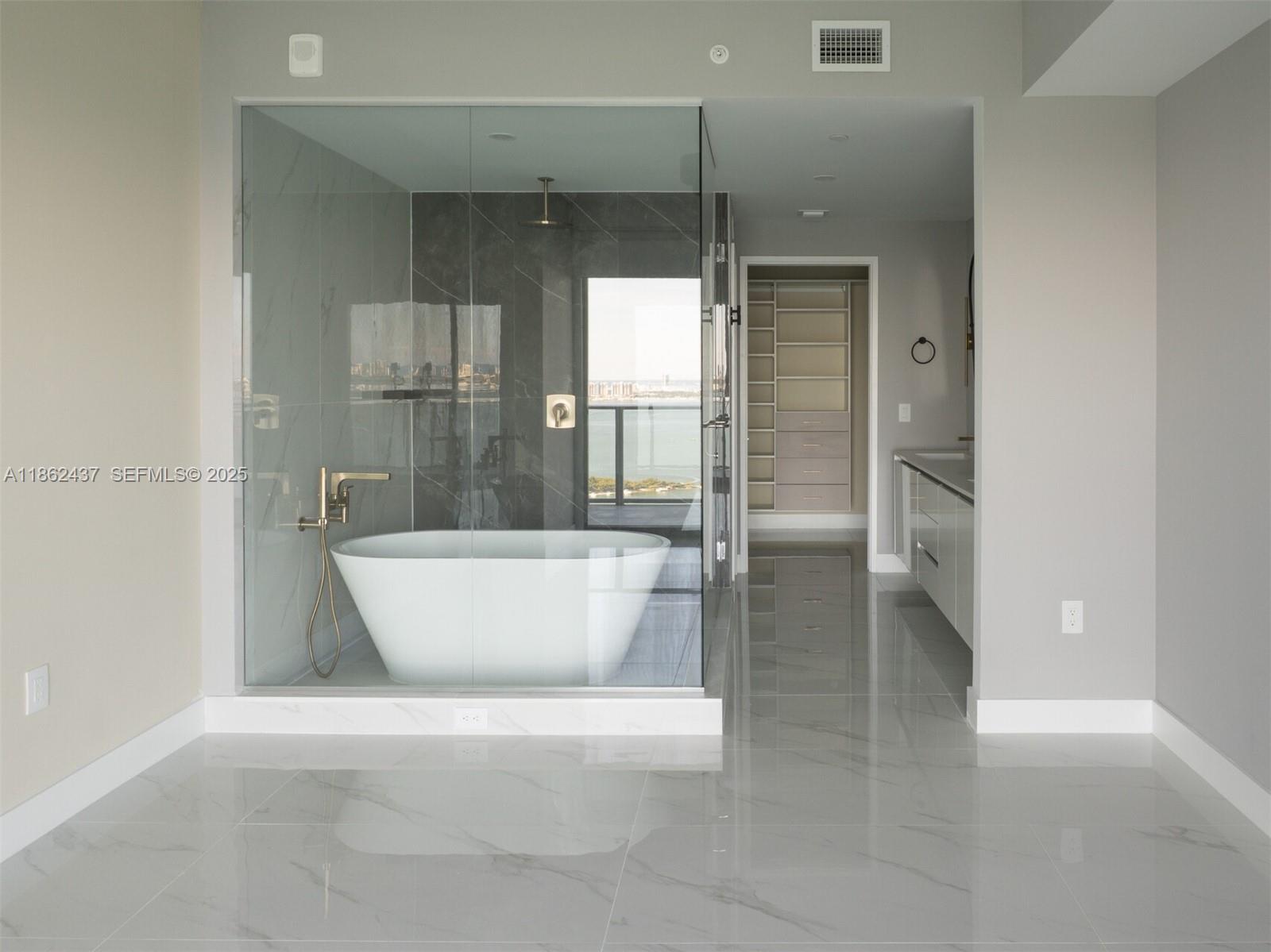 700 Northeast 24th Street, Unit 3304 Miami, FL 33137 - Photo 11 of 64 a view of a bathroom with a bathtub and shower