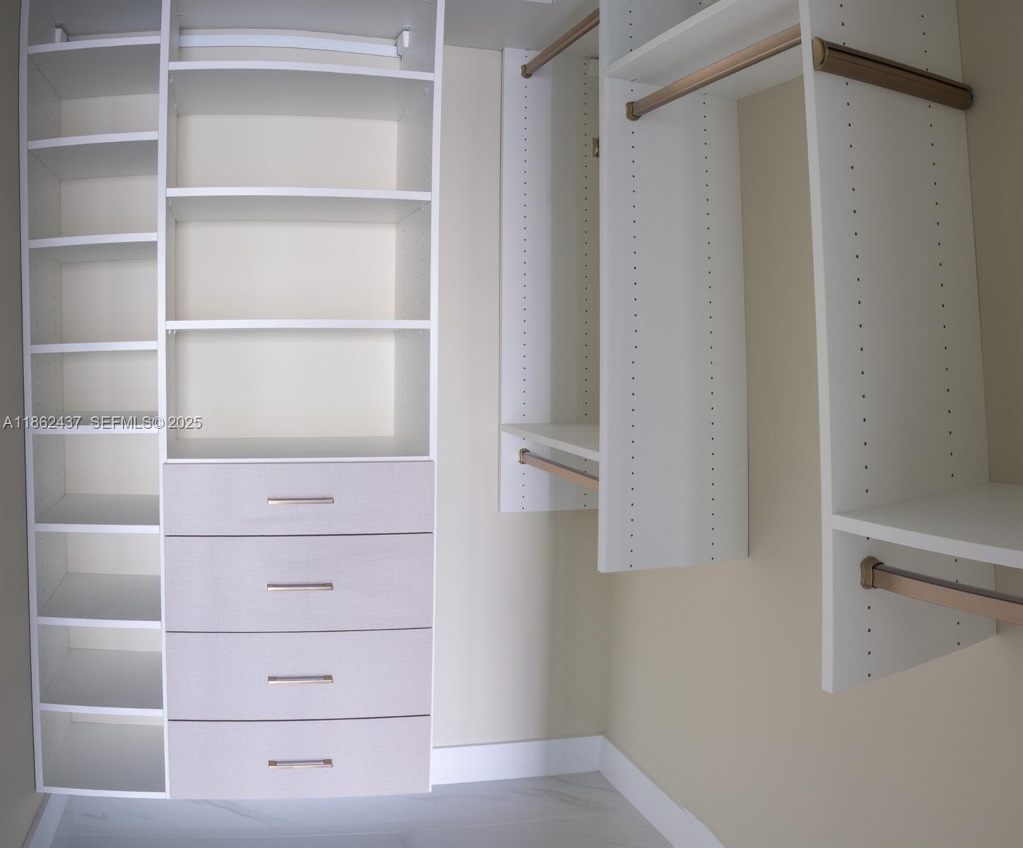 700 Northeast 24th Street, Unit 3304 Miami, FL 33137 - Photo 14 of 64 a view of an empty walk in closet