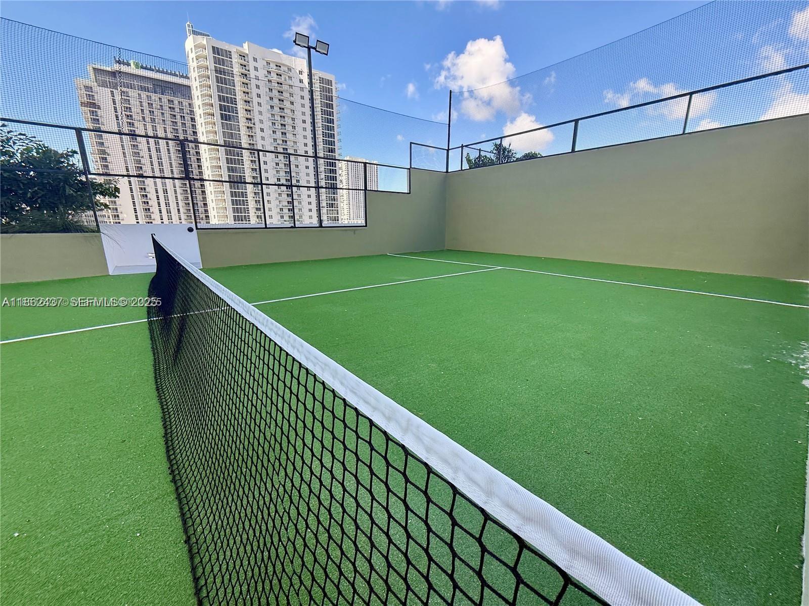 700 Northeast 24th Street, Unit 3304 Miami, FL 33137 - Photo 45 of 64 a view of a balcony with a floor to ceiling window