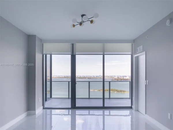 a view of a kitchen with a sink stove and cabinets
