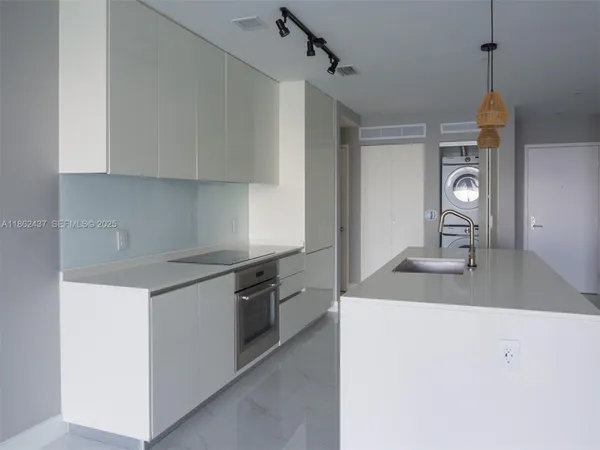 a view of a bathroom with a bathtub and shower