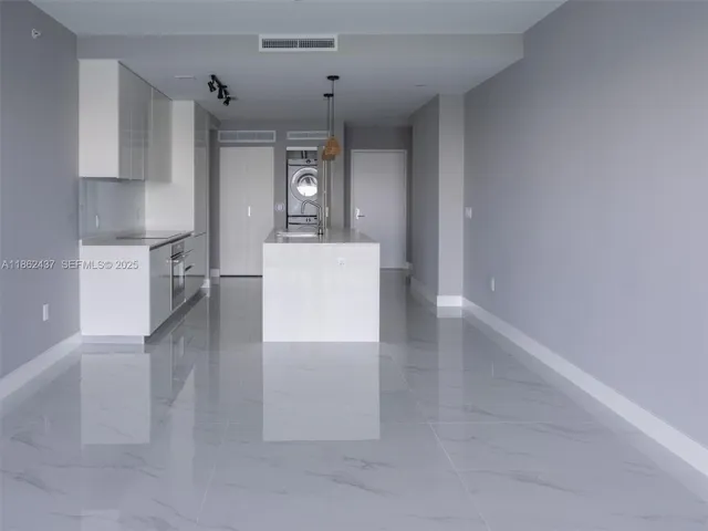 a white bath tub sitting next to a window