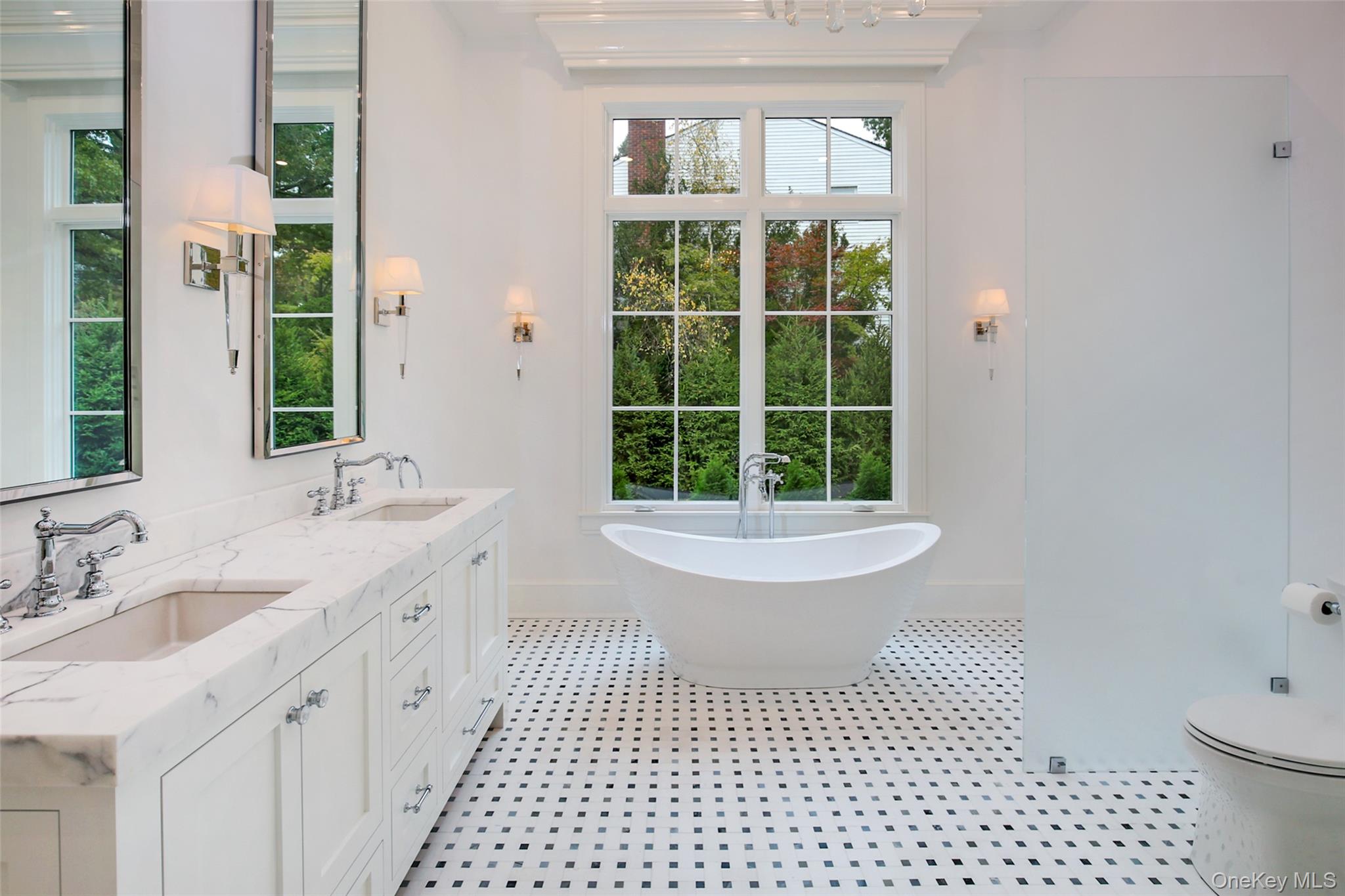 7 Carlton Road Bronxville, NY 10708 - Photo 16 of 35 a bathroom with a sink a toilet a window and shower