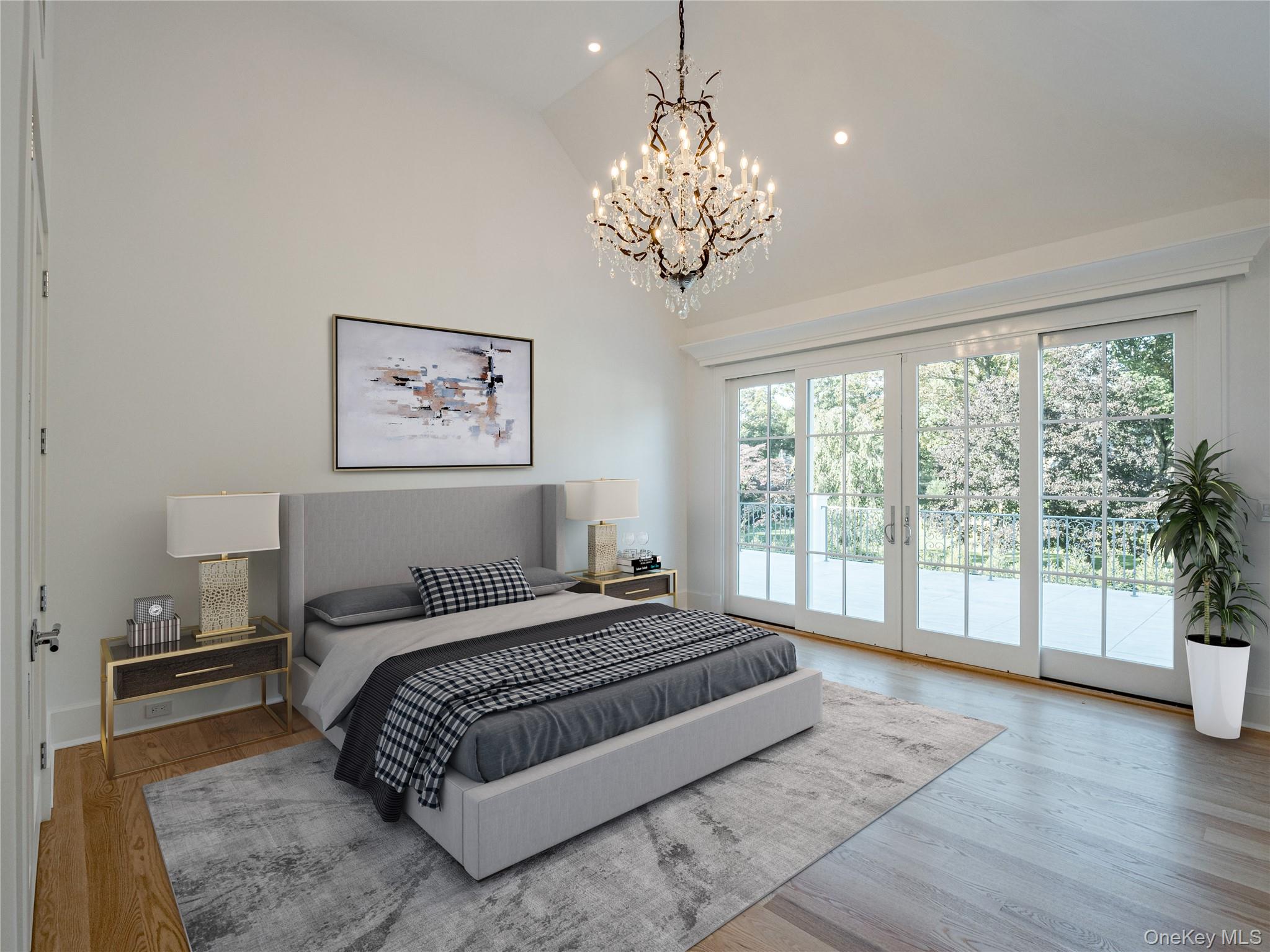 7 Carlton Road Bronxville, NY 10708 - Photo 23 of 35 a spacious bedroom with a large bed and a chandelier