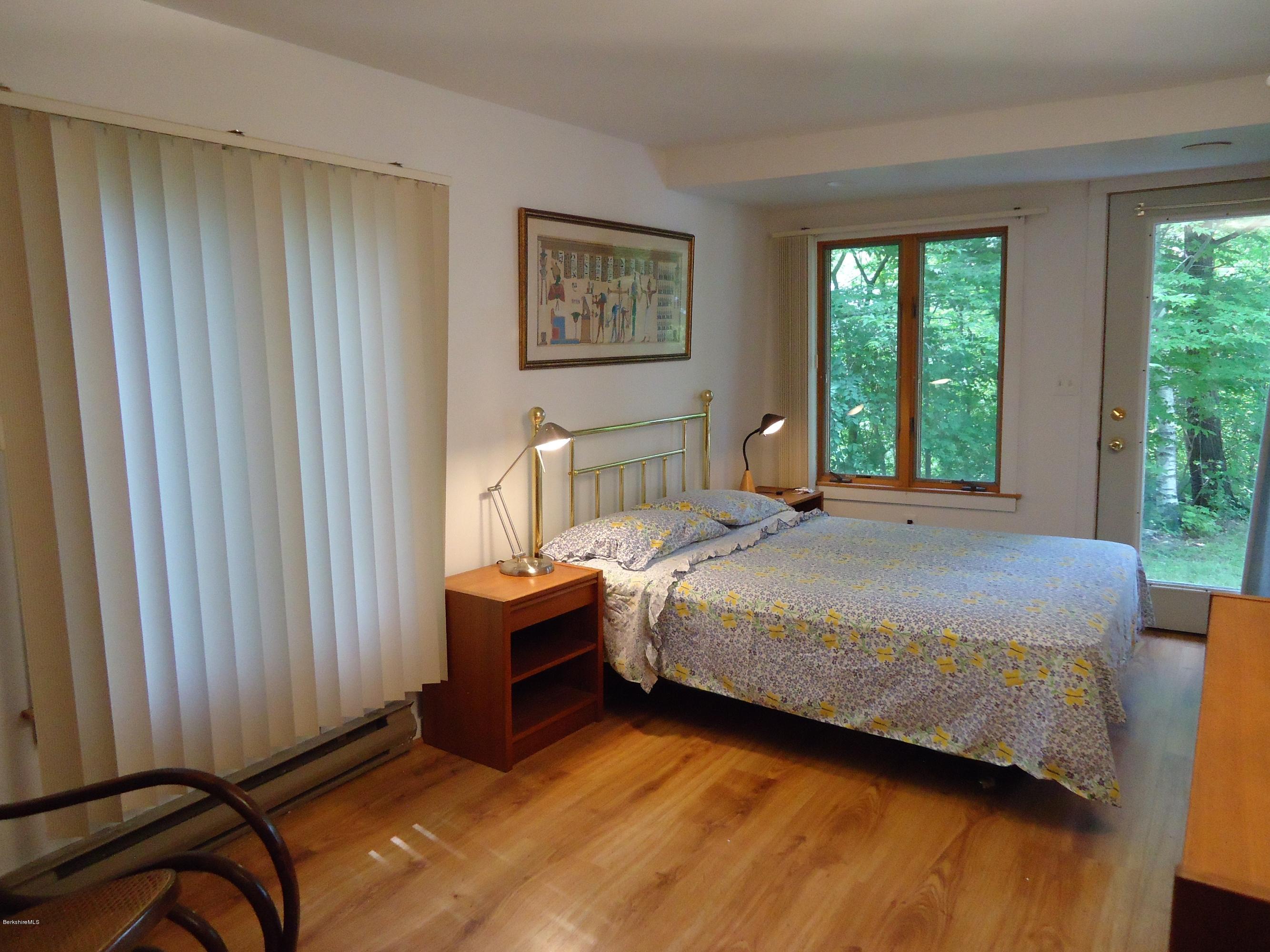 1 Grove Road Stockbridge, MA 01262 - Photo 14 of 17 a bed sitting in a spacious bedroom next to a window