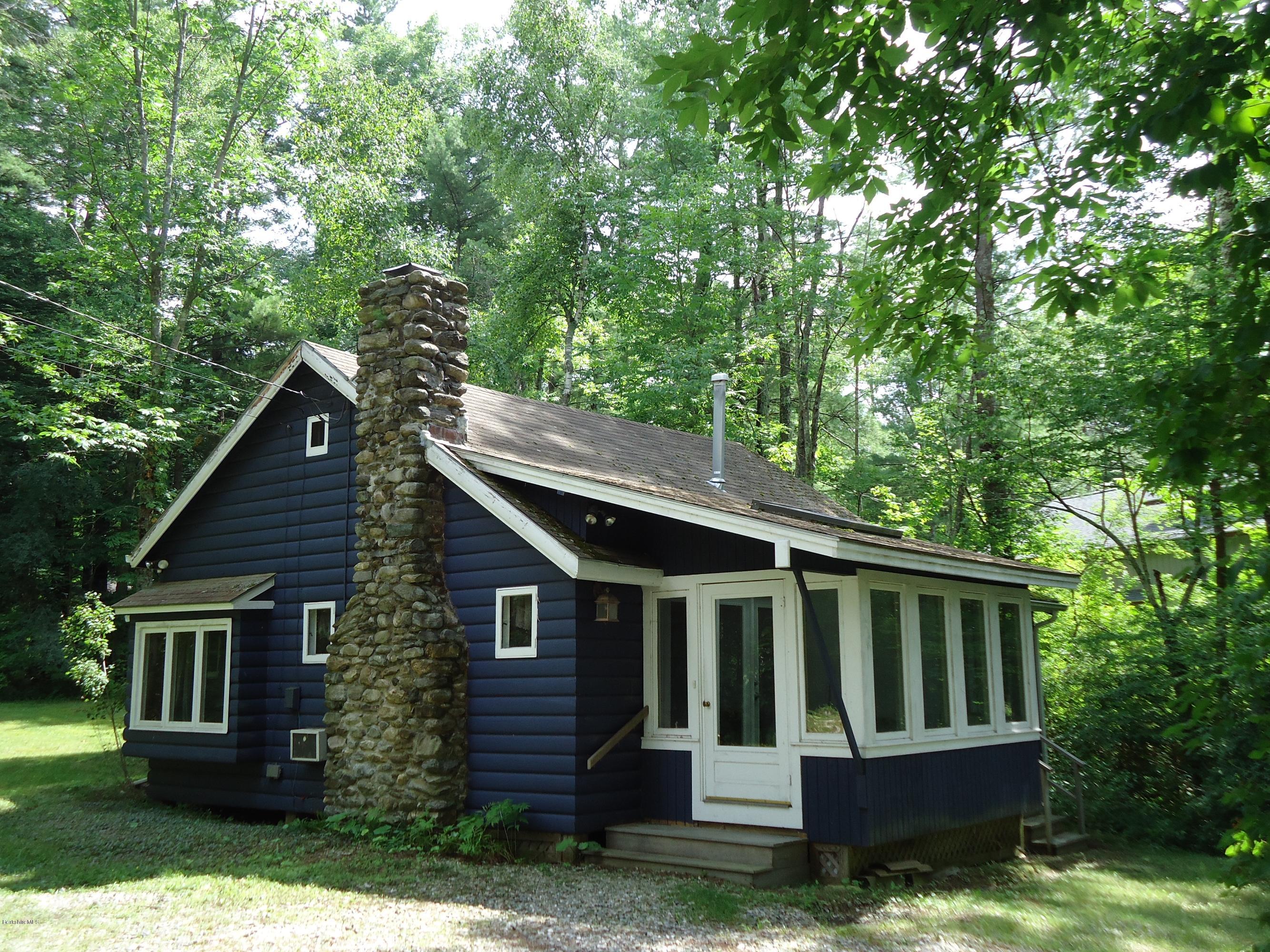 1 Grove Road Stockbridge, MA 01262 - Photo 3 of 17 a view of a small house with a yard