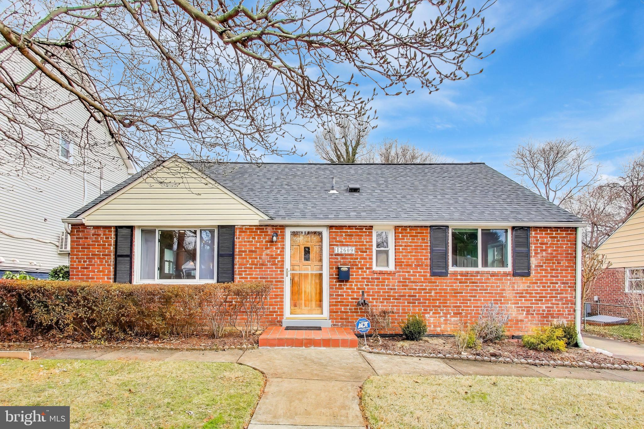 12609 Holdridge Road Silver Spring, MD 20906 - Photo 1 of 30 a front view of a house with a yard