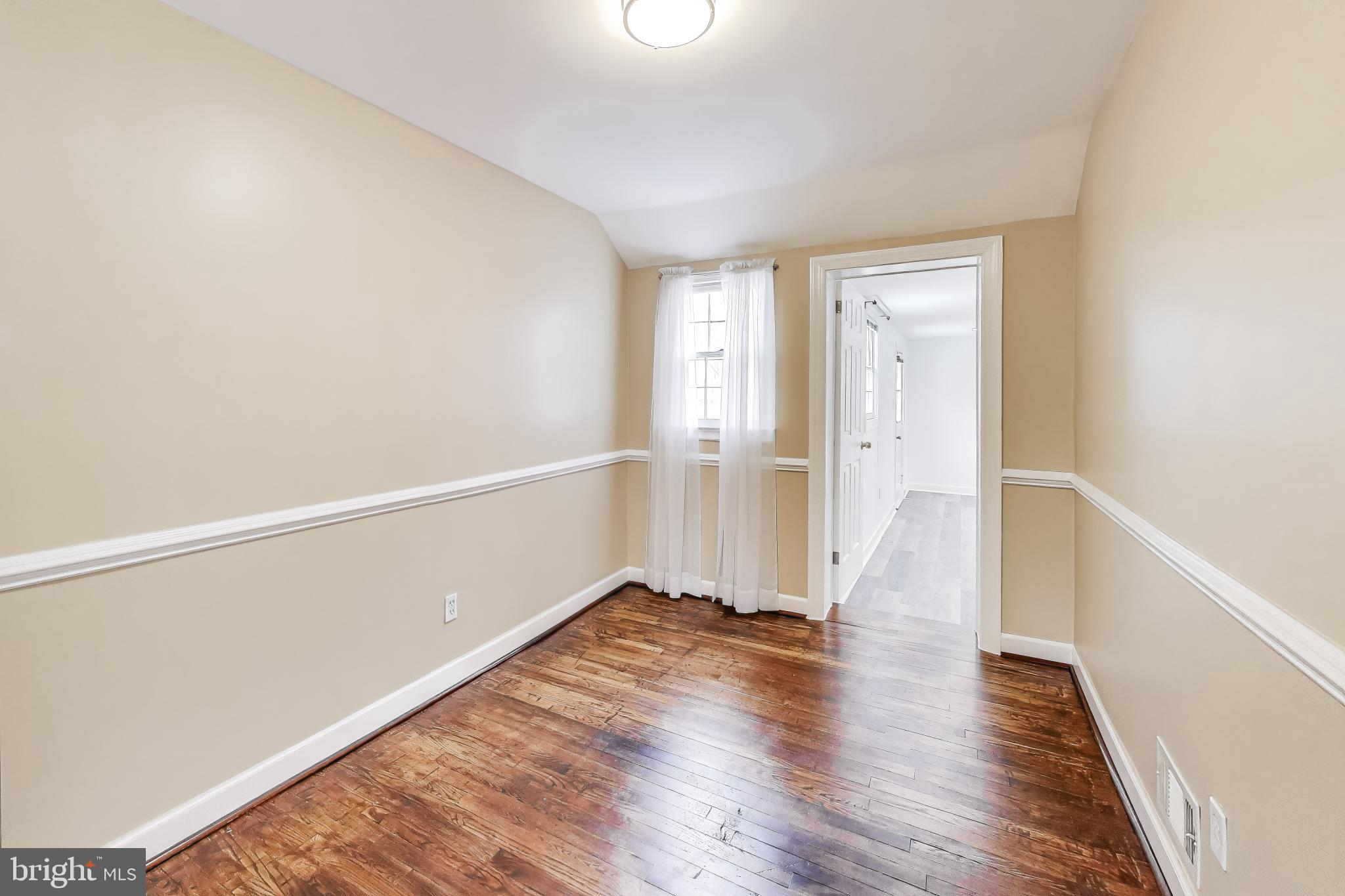 12609 Holdridge Road Silver Spring, MD 20906 - Photo 11 of 30 a view of an empty room with wooden floor