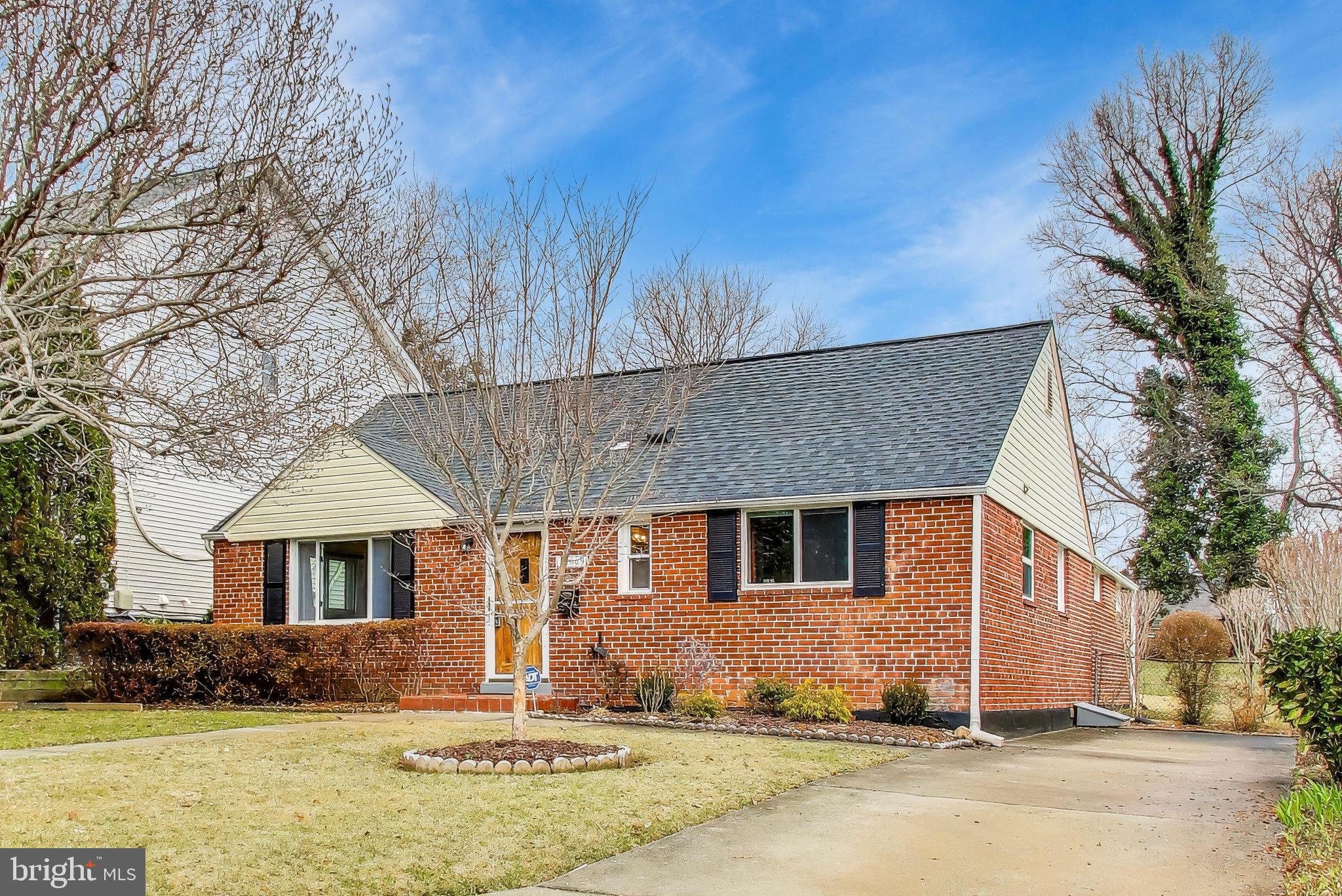 12609 Holdridge Road Silver Spring, MD 20906 - Photo 2 of 30 a front view of a house with a yard