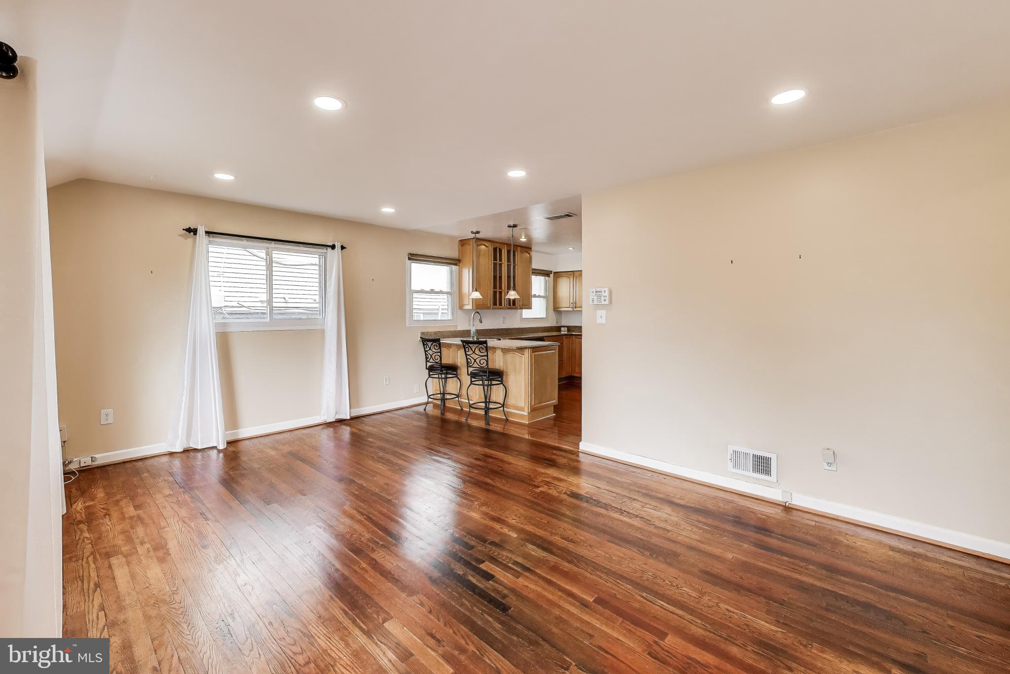 12609 Holdridge Road Silver Spring, MD 20906 - Photo 5 of 30 a view of a kitchen with wooden floor and a window
