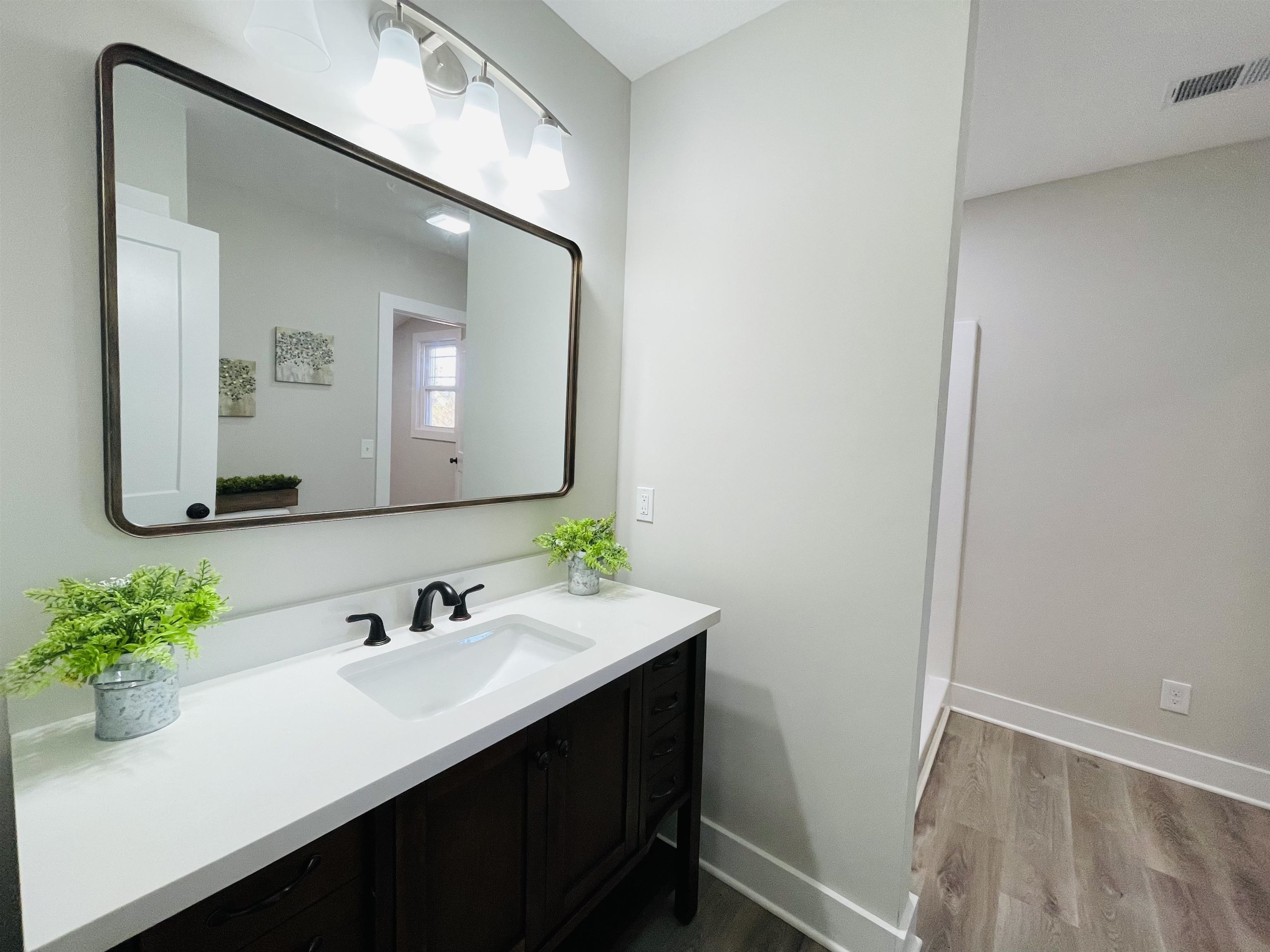 6490 Highway 226 Savannah, TN 38372 - Photo 14 of 38 a bathroom with a sink a light fixture and a mirror