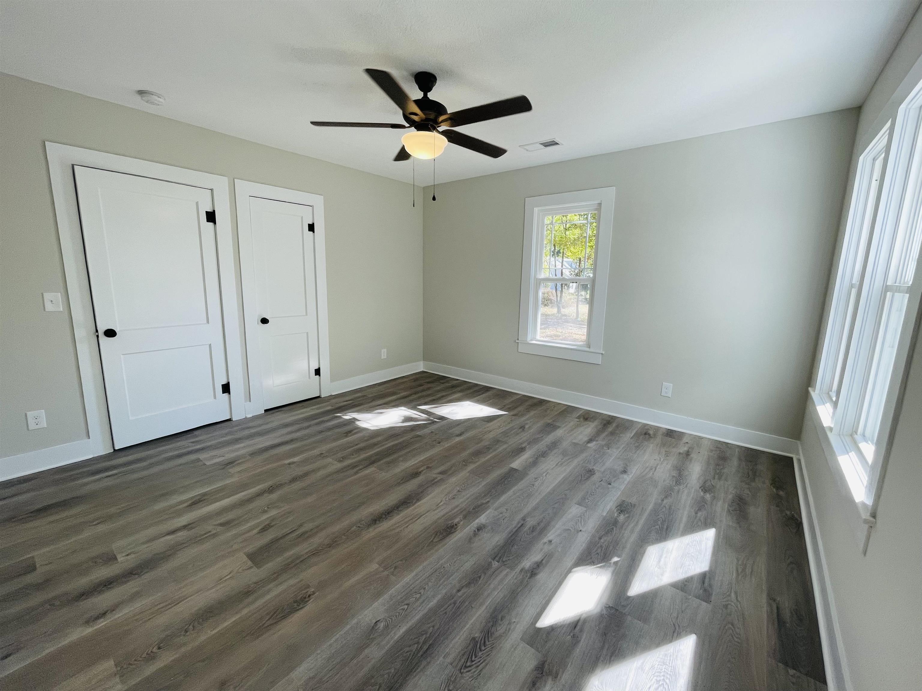 6490 Highway 226 Savannah, TN 38372 - Photo 15 of 38 a view of empty room with wooden floor and fan