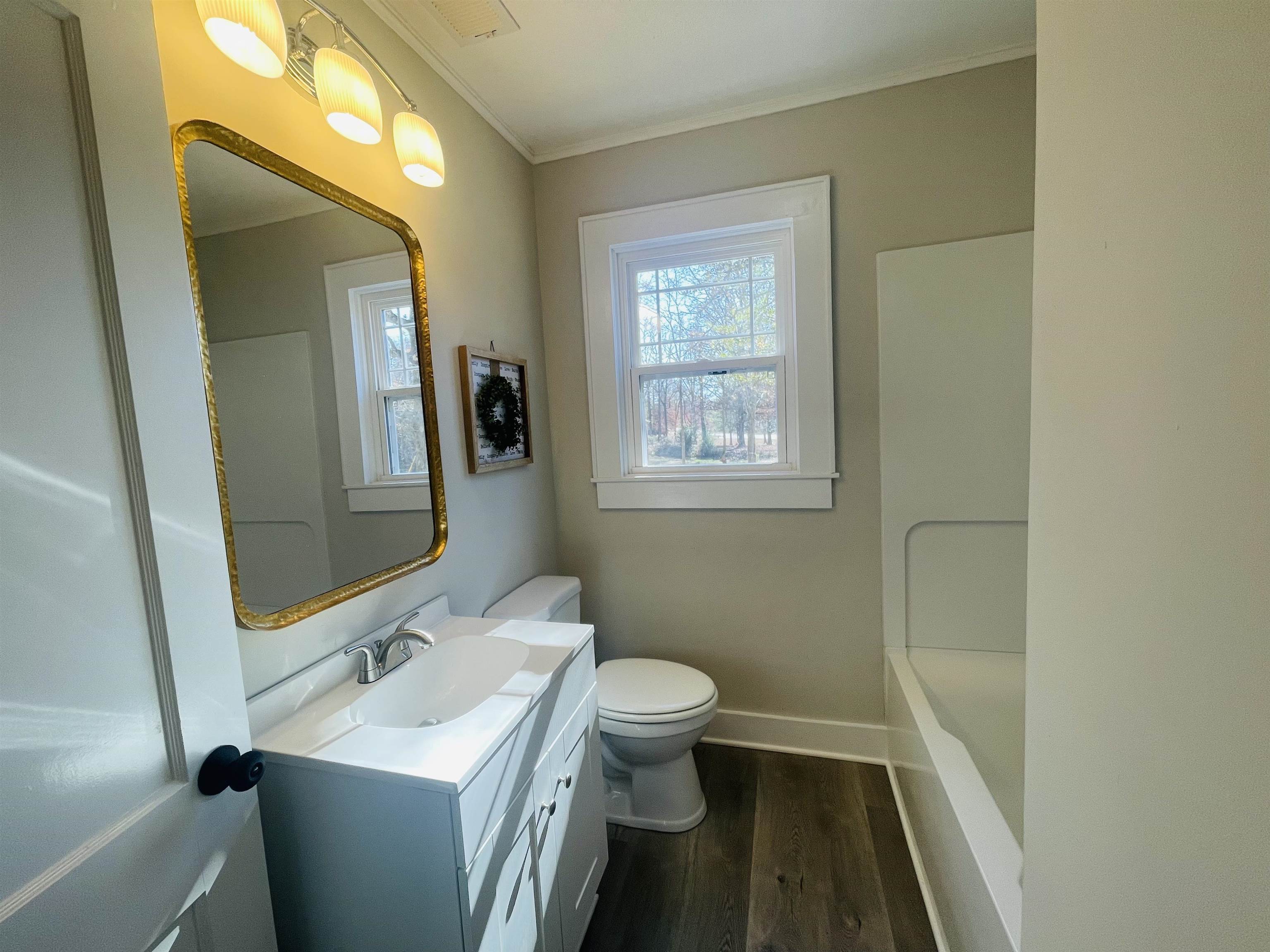 6490 Highway 226 Savannah, TN 38372 - Photo 17 of 38 a bathroom with a sink toilet and mirror