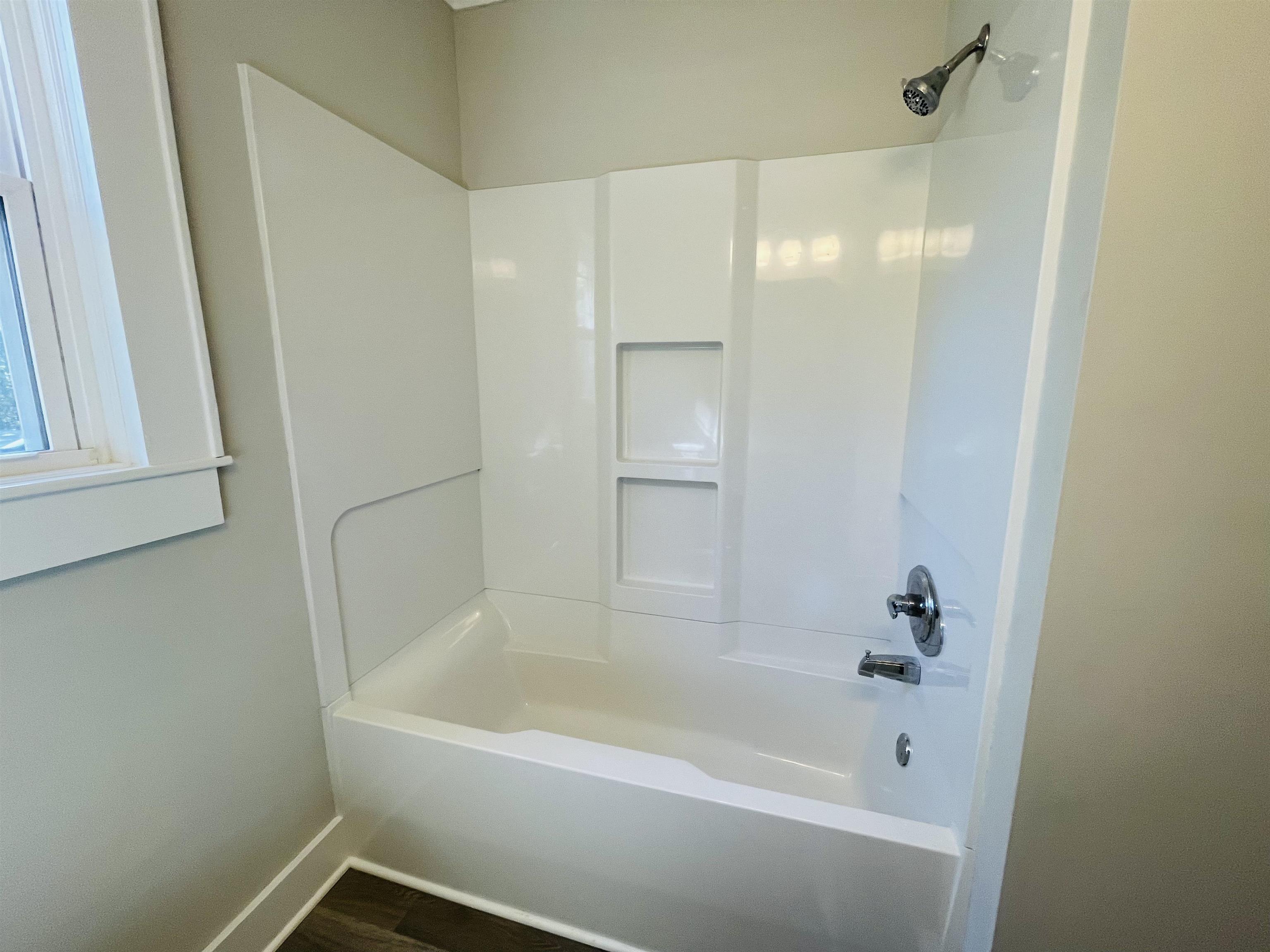6490 Highway 226 Savannah, TN 38372 - Photo 18 of 38 a white bath tub sitting next to a shower