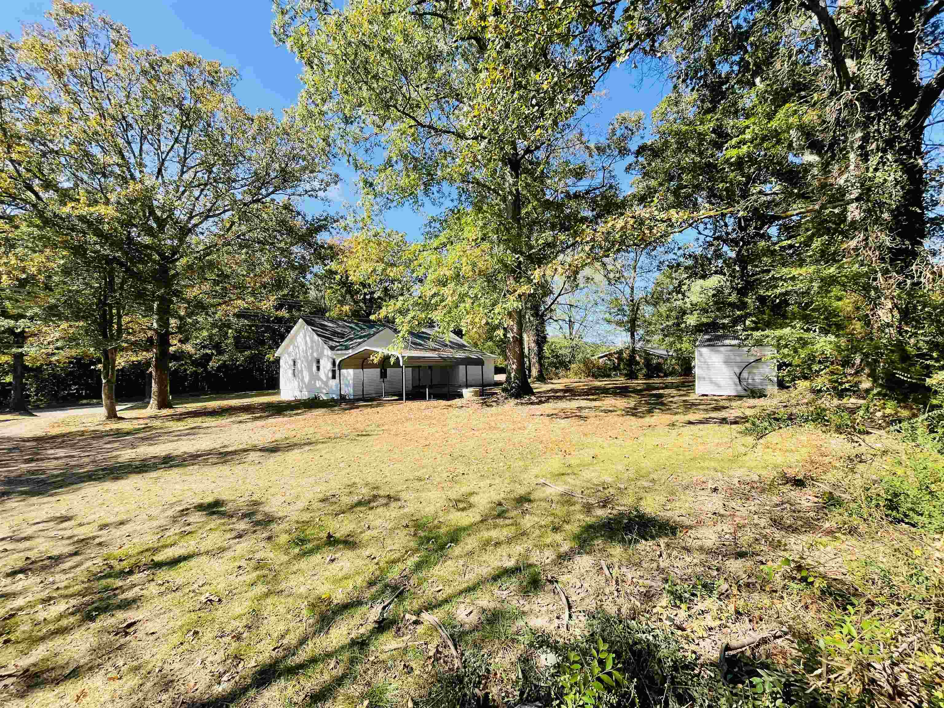 6490 Highway 226 Savannah, TN 38372 - Photo 22 of 38 a view of yard with swimming pool and trees