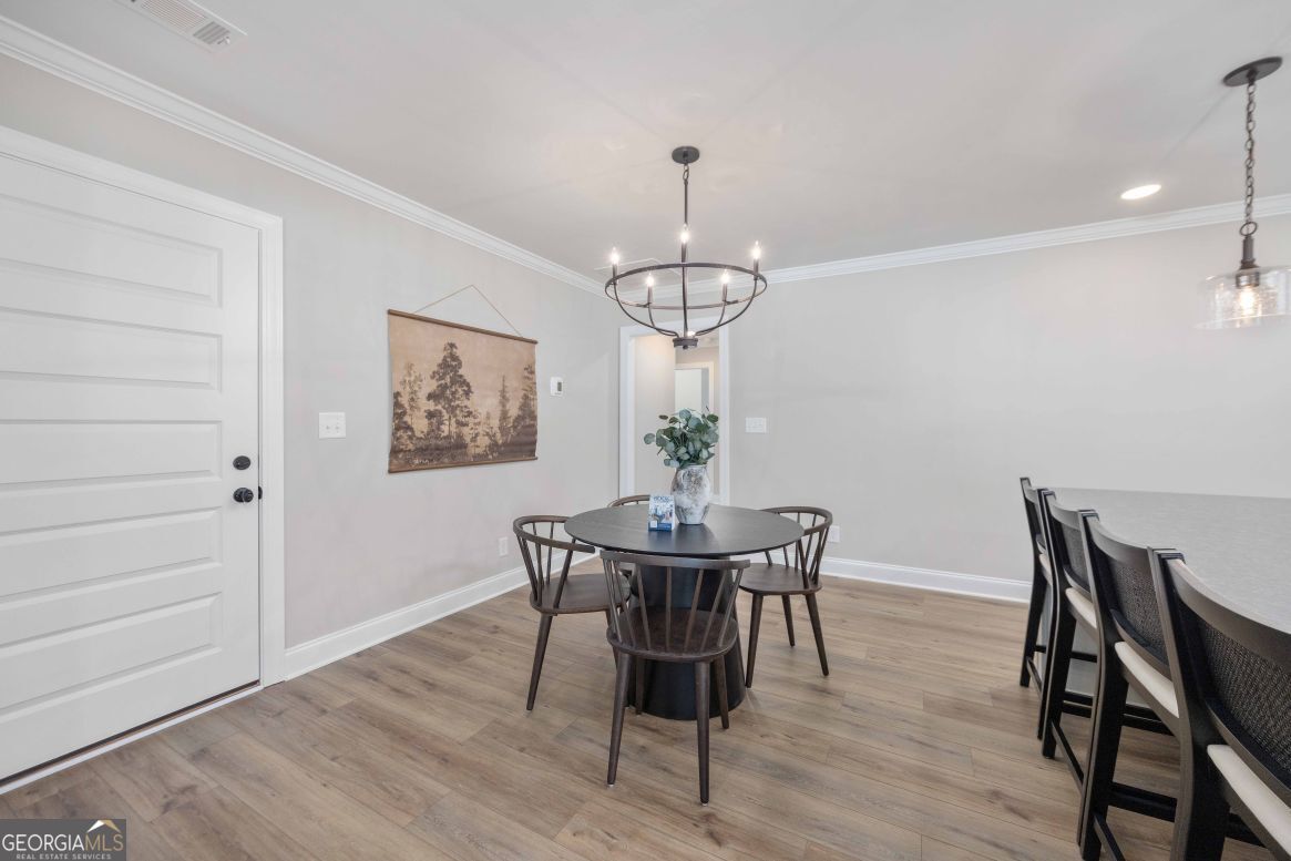 23 Rivers Edge Lane Franklin, GA 30217 - Photo 10 of 32 a view of a dining room with furniture and wooden floor