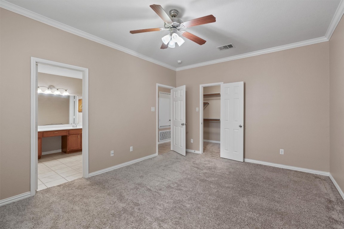 1609 Hidden Springs Path Round Rock, TX 78665 - Photo 13 of 37 a view of an empty room with a ceiling fan