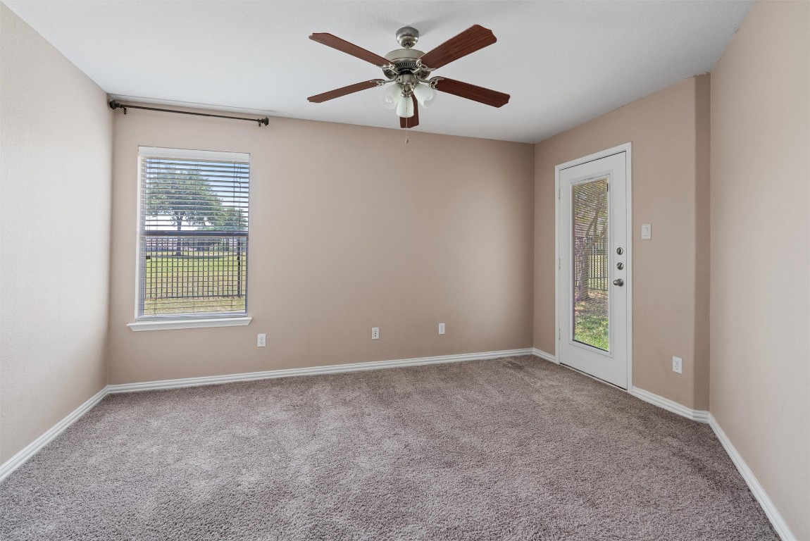 1609 Hidden Springs Path Round Rock, TX 78665 - Photo 18 of 37 a view of an empty room with a window