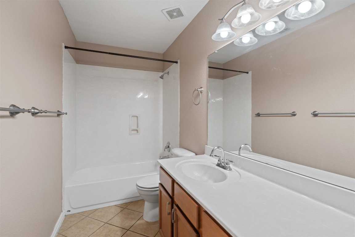 1609 Hidden Springs Path Round Rock, TX 78665 - Photo 19 of 37 a bathroom with a sink a toilet and shower