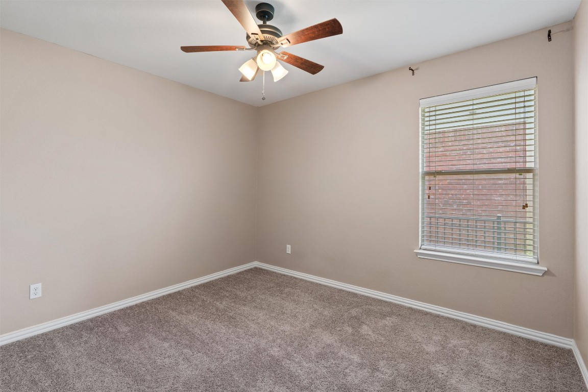 1609 Hidden Springs Path Round Rock, TX 78665 - Photo 20 of 37 an empty room with a window and a fan
