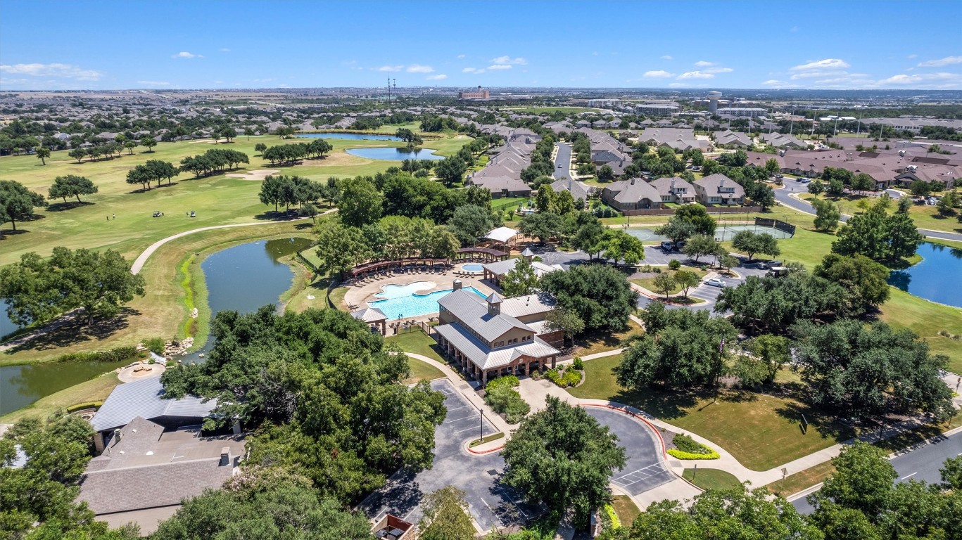 1609 Hidden Springs Path Round Rock, TX 78665 - Photo 37 of 37 an aerial view of a city with lots of residential buildings ocean and mountain view in back