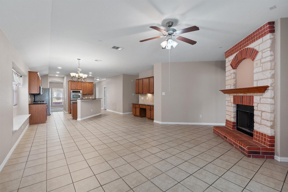 1609 Hidden Springs Path Round Rock, TX 78665 - Photo 10 of 37 a view of a livingroom with furniture and a fireplace