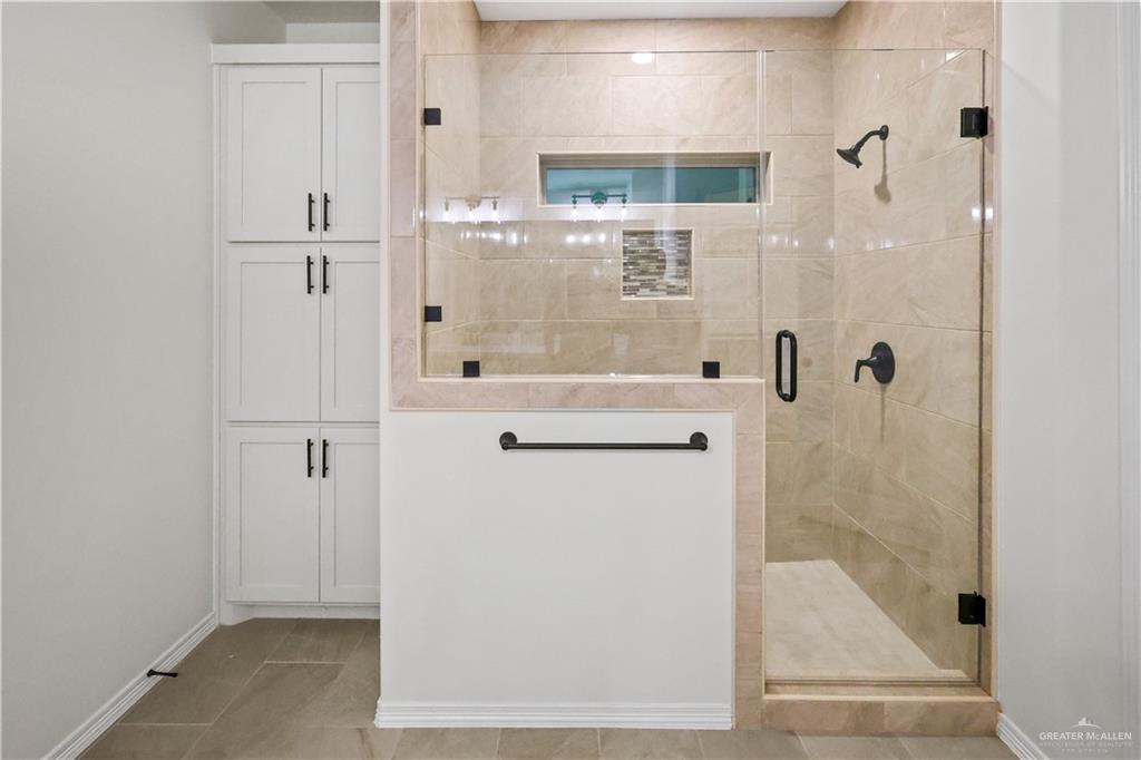 7305 North 55th Lane Mission, TX 78573 - Photo 12 of 26 a bathroom with a shower