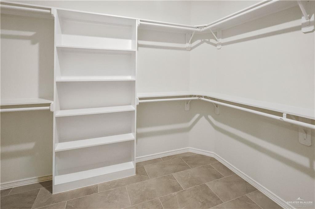 7305 North 55th Lane Mission, TX 78573 - Photo 14 of 26 a view of an empty walk in closet