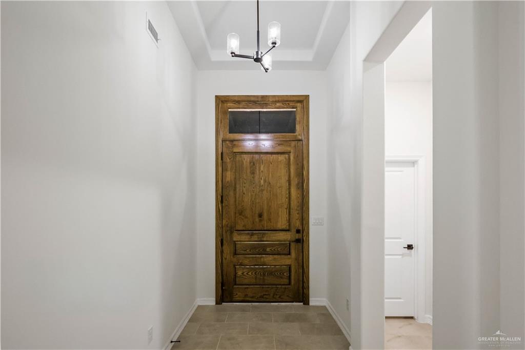 7305 North 55th Lane Mission, TX 78573 - Photo 20 of 26 a view of a hallway with a elevator