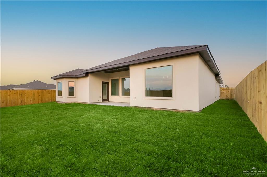 7305 North 55th Lane Mission, TX 78573 - Photo 25 of 26 a view of a house with backyard