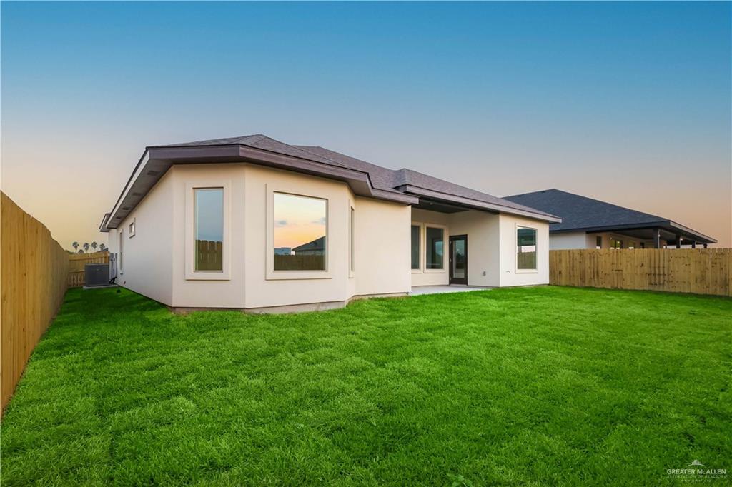 7305 North 55th Lane Mission, TX 78573 - Photo 26 of 26 a front view of a house with a yard