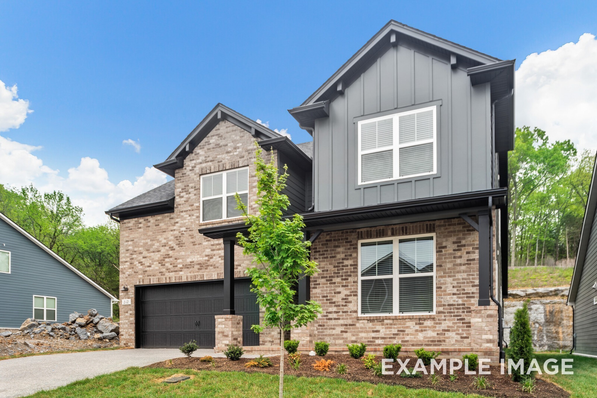 2882 Barnwood Road Gallatin, TN 37066 - Photo 6 of 99 a front view of a house with garden