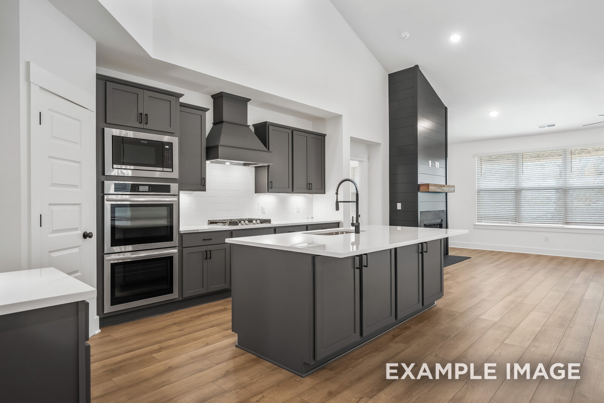 2882 Barnwood Road Gallatin, TN 37066 - Photo 64 of 99 a large kitchen with stainless steel appliances wooden cabinets and a stove top oven