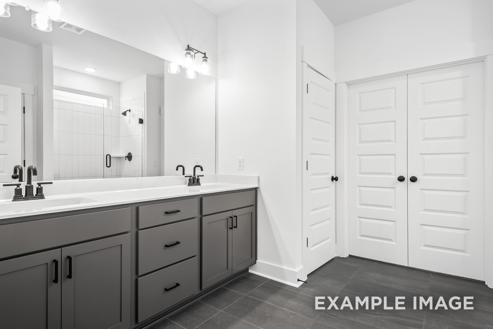 2882 Barnwood Road Gallatin, TN 37066 - Photo 70 of 99 a spacious bathroom with a sink a mirror and a bathtub