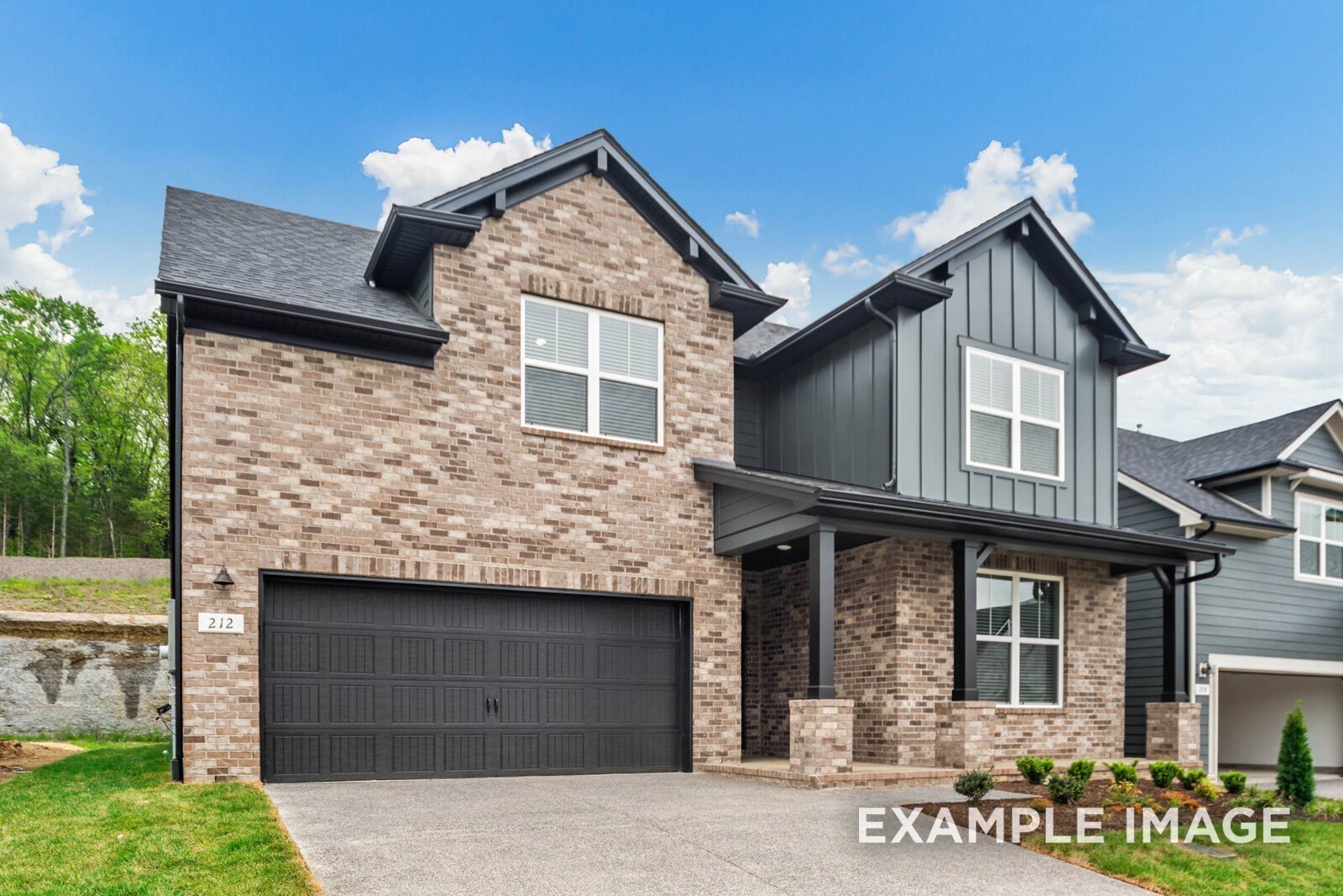 2882 Barnwood Road Gallatin, TN 37066 - Photo 7 of 99 a front view of a house with a garden