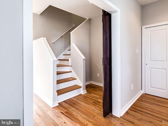 4427 Mitchell Street Philadelphia, PA 19128 - Photo 12 of 24 a view of a hallway with wooden floor and staircase