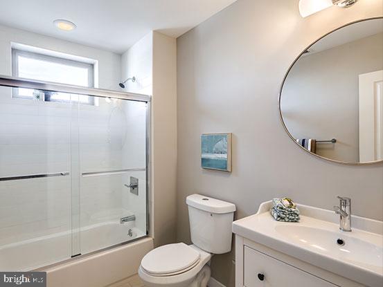4427 Mitchell Street Philadelphia, PA 19128 - Photo 14 of 24 a bathroom with a sink toilet and a mirror