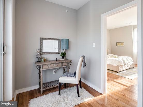 4427 Mitchell Street Philadelphia, PA 19128 - Photo 16 of 24 a view of a bedroom with a bed and a potted plant
