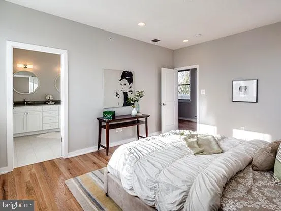 a bedroom with a bed and a dresser