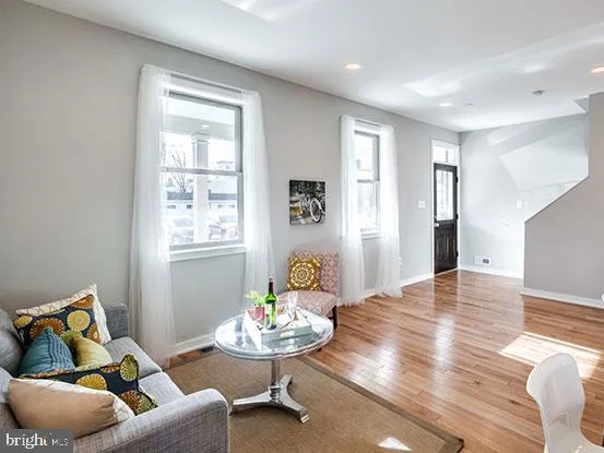 a living room with furniture and window