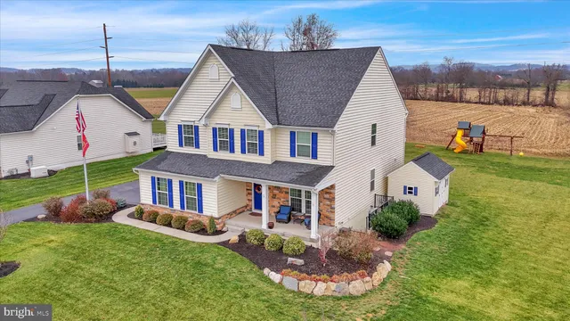 a view of a livingroom with furniture window and wooden floor