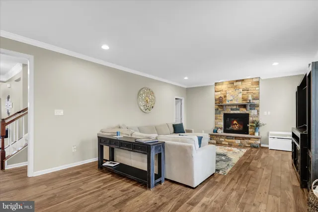 a bathroom with a sink a toilet a mirror and shower