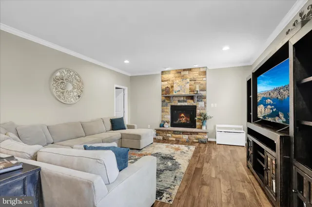 a spacious bedroom with a bed and dresser