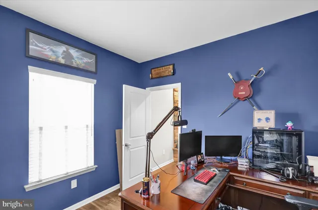 a bathroom with a granite countertop sink mirror and shower